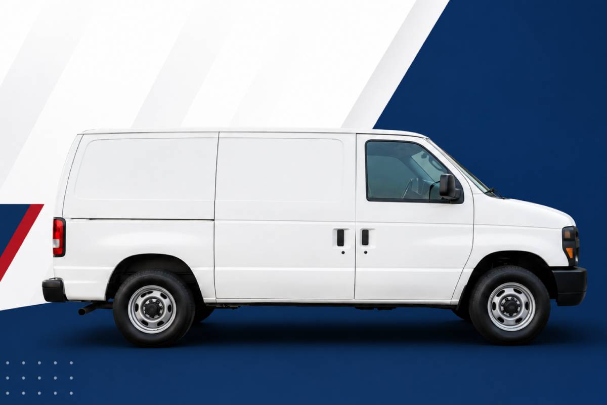 A side-view photo of a cargo van parked in a standard suburban driveway to show scale relative to a house.